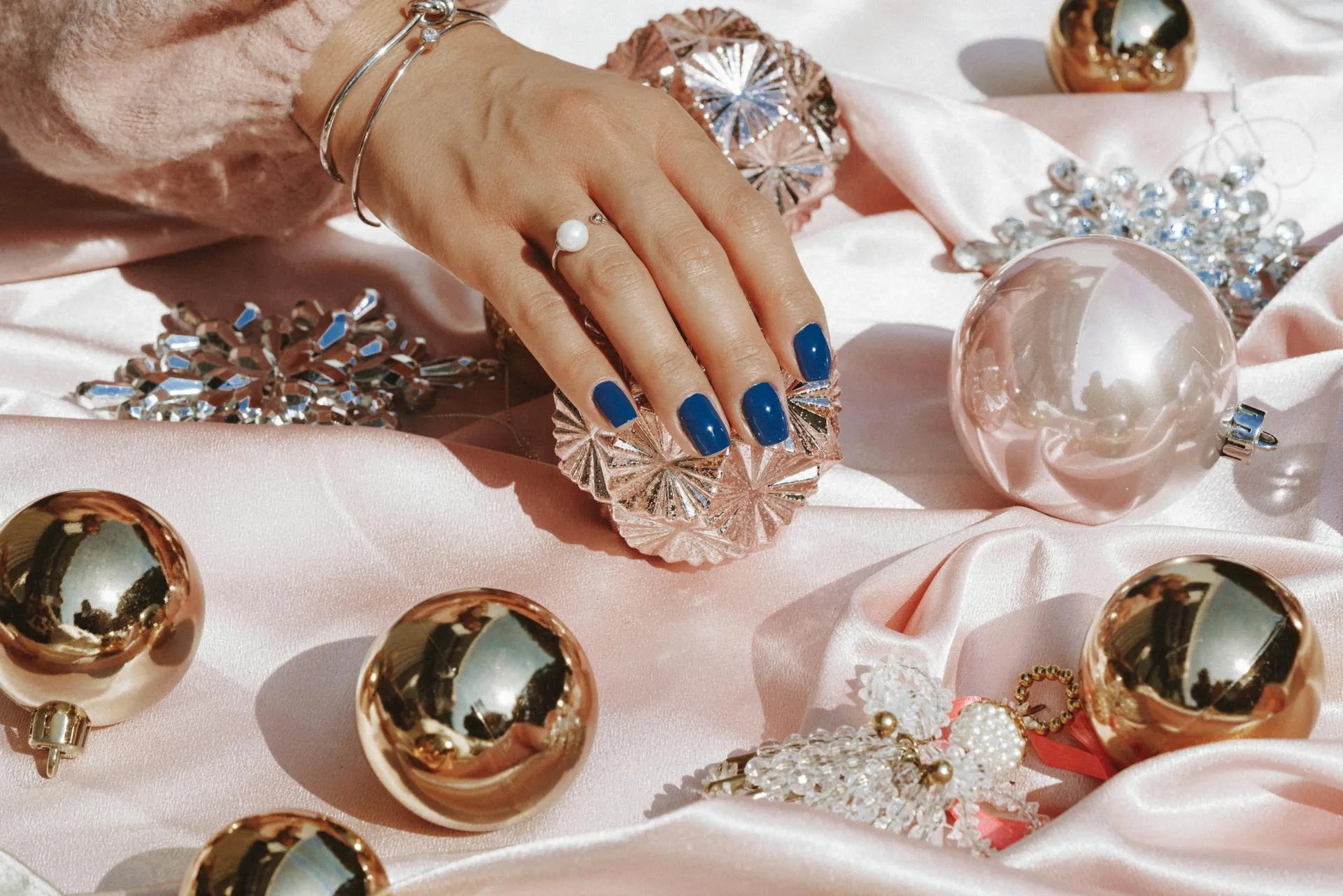 Blue nails touching crystal balls